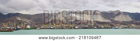 Russia Novorossiysk - October 28.2017: Panorama of Novorossiysk cargo port and Smoking chimneys of a cement plant of JSC 
