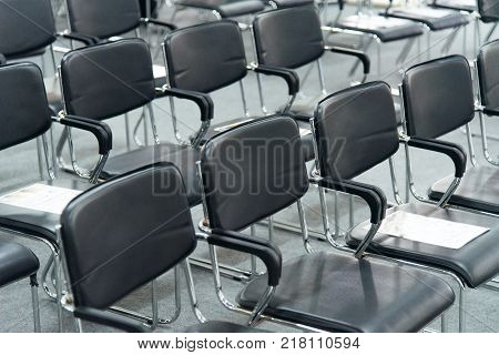 conference hall with Black empty chairs in row