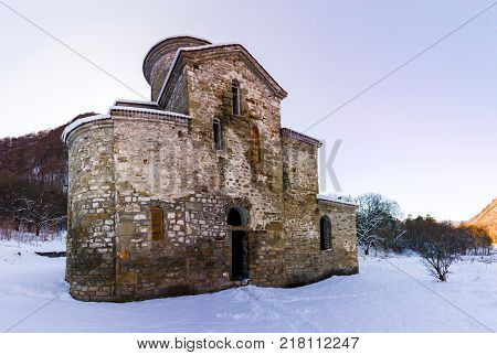 North Caucasus. Lower-Arkhyz settlement. Abandoned orthodox temple. Winter landscape