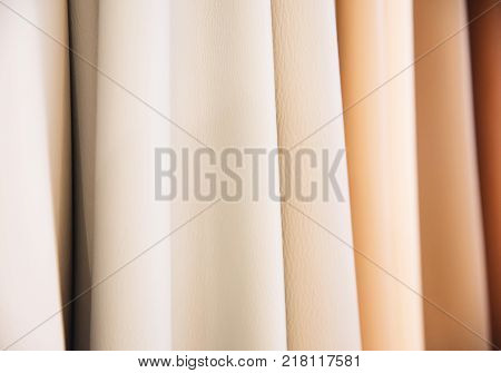 Color palette sample of leather material as a background.