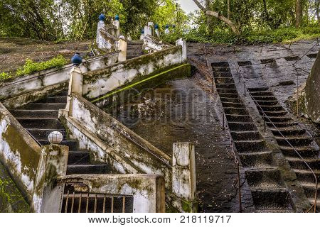 An old staircase and an ancient rocky staircase in Buddhist rock temple in Mulkirigala, Sri Lanka