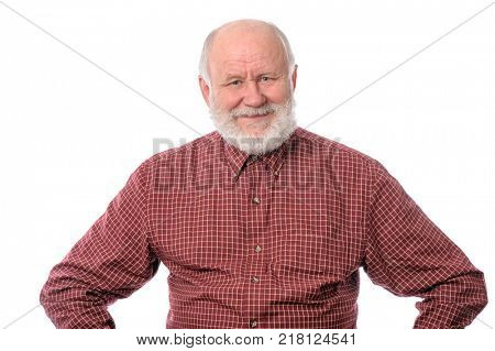 Cheerful and calm handsome bald and bearded senior man with arms akimbo, isolated on white background