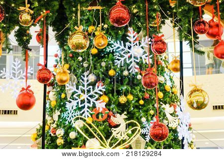 Many Colorful Christmas Ball Hang By Ribbin With Fake Christmas Tree For Background (selective Focus