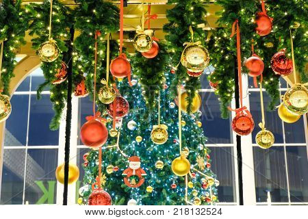 Many Colorful Christmas Ball Hang By Ribbin With Fake Christmas Tree For Background (selective Focus