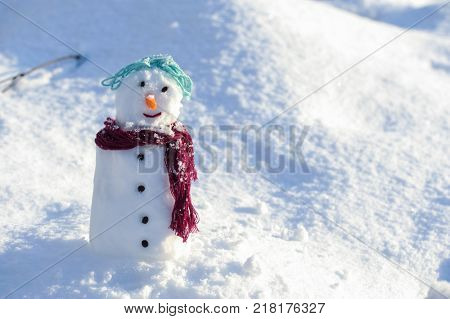 Little small Snowman in snow with copy space
