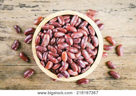 Red bean kidney in a bowl on wooden background top view vintage tone Red bean. Red bean on table.