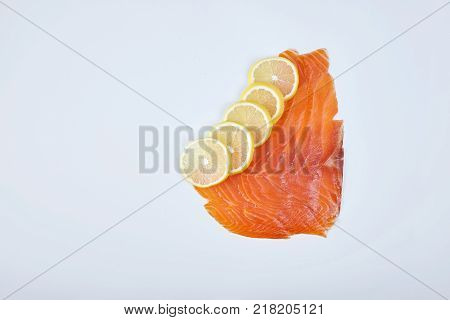 Smoked Fillet trout with lemon, isolated. Seafood