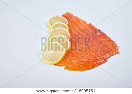 Smoked Fillet trout with lemon, isolated. Seafood