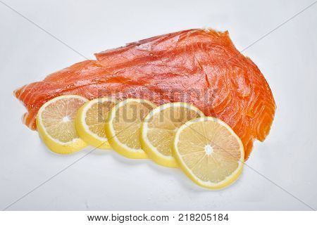 Smoked Fillet trout with lemon, isolated. Seafood