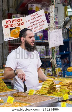 TEL AVIV , ISRAEL - 21 NOVEMBER 2017: Sellers on the old grocery street Nahalat-Benjamin