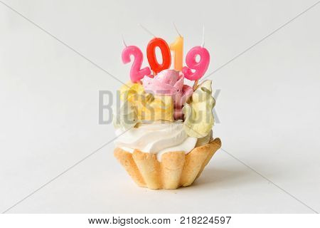 2018 Happy New Year Cupcakes. sweet cake with figures 2018 new year decor. isolated on white background