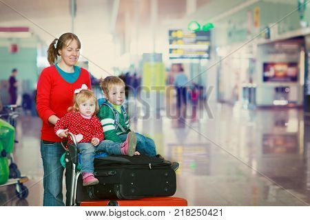 mother with son and daughter travel in airport