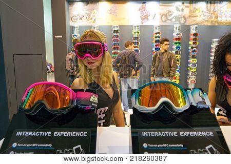 MILAN, ITALY - NOVEMBER 11, 2017: women wear Ethen products EICMA 2017 - 75th International Motorcycle Exhibition