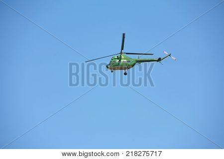Military helicopters against the blue sky. Helicopter in flight