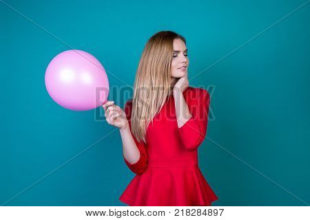beautiful girl with balls on a bright background a pa