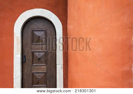 monastery zica church wooden door with red wall