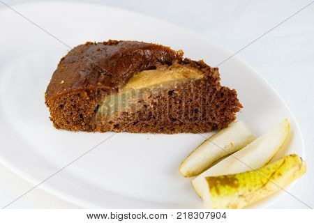 A slice of pear brownie pie with pieces of pear