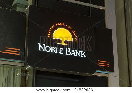 Gdansk, Poland - December 9, 2017: Noble Bank sign and logo at night time.