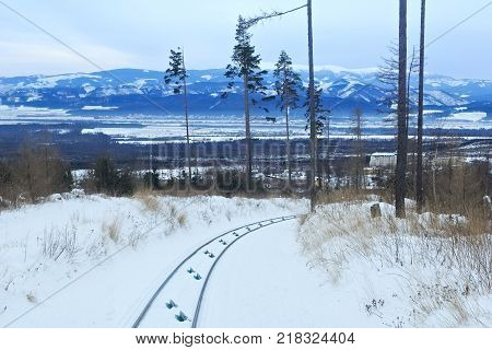 View of the funicular railway at High Tatras mountains National park in Slovakia. Railroad leads to popular ski and tourist resort Hrebienok (altitude 1285 m.) from Stary Smokovec village.