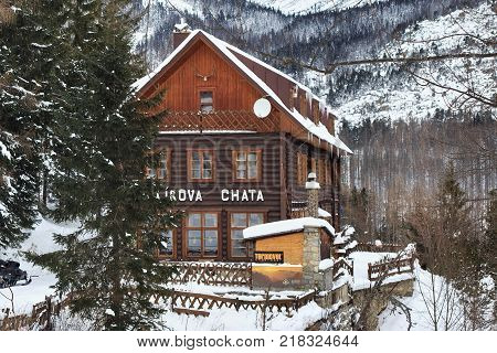 HREBIENOK, SLOVAKIA - JANUARY 07, 2015: Wooden hotel called Bilikova chata. Is a historical high mountain cottage in the Tatra National park. It lies on the southeastern foot of the Slavkovsky peak.