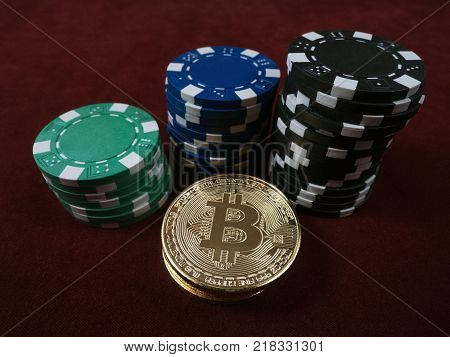Bitcoin coins and poker chips. New virtual and real currency. The concept of replacement bitcoin in all forms of payment.