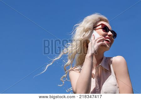 Beautiful Girl is Calling on the Phone and Laughing