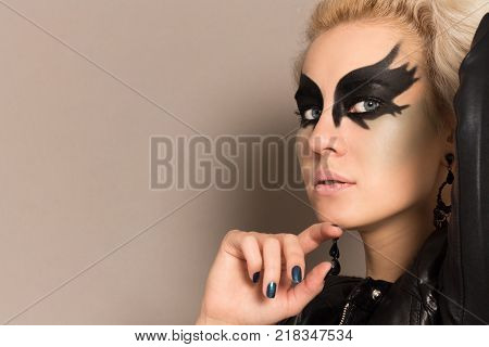 Young Woman with Art Make-up. Copy Space