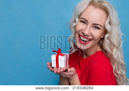 Young Woman Emotionally Rejoices Present. Copy Space