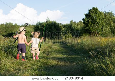 Boy and Girl Go for the Hand with Fishing Rods