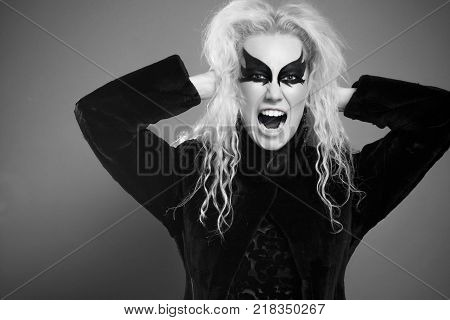 Woman in Black Clothes Furiously Shouts. Emotions
