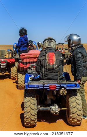 Ait Saoun Morocco - February 23 2016: Riders with quad bikes getting ready for race raly in Ait Saoun village desert in Morocco.