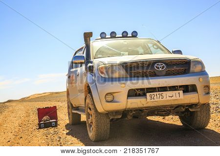 Ait Saoun Morocco - February 23 2016: Stationary Toyota Hilux with tool box besides in the middle of Ait Saoun desert of Morocco.