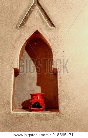 Red terecotta aroma difuser kept in hole in hut to keep light