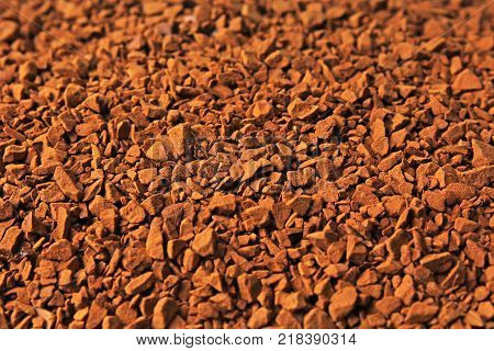 Instant coffee texture pattern. Brown cofee instant powder grains.