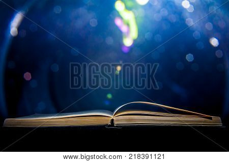 Opened book with blue circle shaped noisy background.
