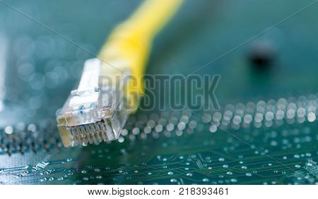 Yellow internet switch close up on computer circuit board