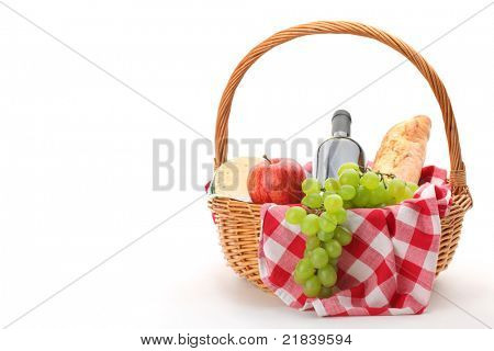 picnic basket with fruit bread and wine.