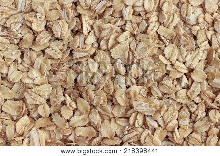 Oat flakes (oatmeal) close-up. Natural and healthy food. Background or texture.