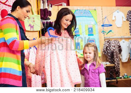 mother and daughter shopping at children's store
