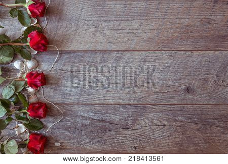 Valentines day background with red roses and shells. Wedding background. Top view, copy space. Mother's, Valentines, Women's Wedding Day concept.