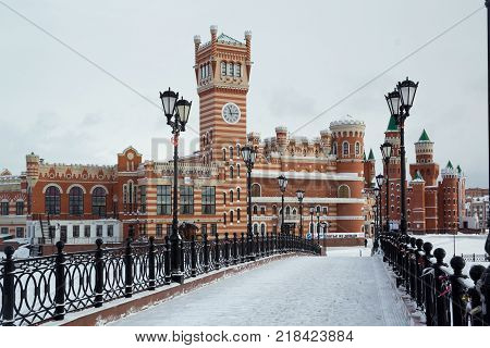 Yoshkar-Ola, Russia - December 6, 2016 View from the Sunday Bridge to the beautiful administrative building on Patriarch's Square in Yoshkar-Ola, Russia