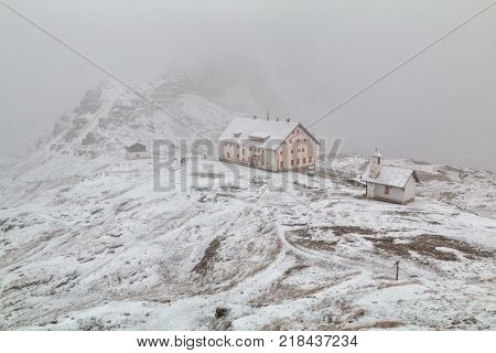 Tre Cime di Lavaredo in beautiful surroundings in the Dolomites at foggy winter weather in Italy Europe (Drei Zinnen)