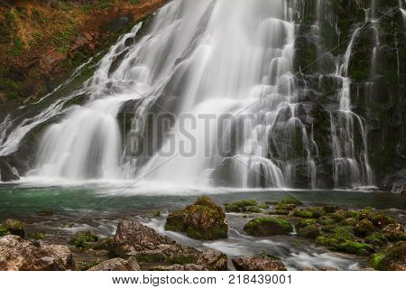 Beautiful Golling waterfall and near Golling and Salzach medieval town at autumn in Austria