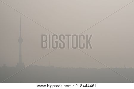 Sunrise on pollution peak day in Wuhan central China with visible dirty haze in the air with view of tortoise mountain