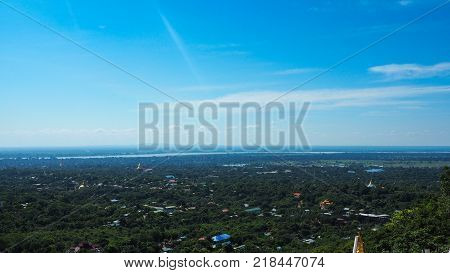 High angle view of multiple temples and pagodas on the mountains with Irrawaddy river in the background from sagaing hill, Sagaing region of Myanmar