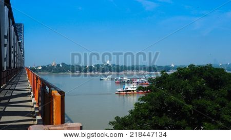 View of multiple temples and pagodas on the Bridge with Irrawaddy river, Sagaing region of Myanmar.