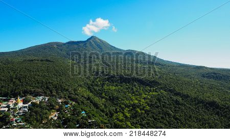High angle view of multiple temples and pagodas on the Mt. Popa - holy mountain for burmese people with lots of temples on the top. Located in southeast of Bagan Myanmar (Burma).