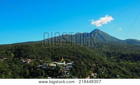 High angle view of multiple temples and pagodas on the Mt. Popa - holy mountain for burmese people with lots of temples on the top. Located in southeast of Bagan Myanmar (Burma).