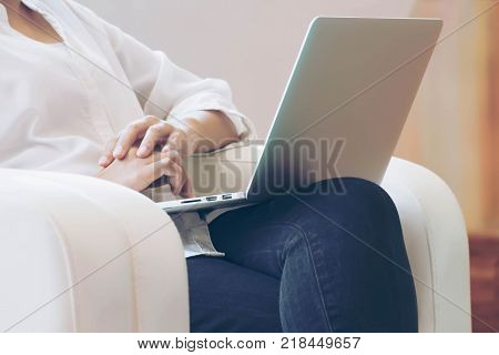 Southest Asian Business Woman Working on Labtop in a Library at Office Building