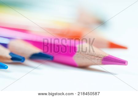 Colorful pencils close up shot isolated on white